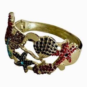 Under-the-Sea Rhinestone Cuff Bracelet, Gold-Tone, Featuring Starfish & Shells.